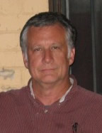 An older man with gray hair.