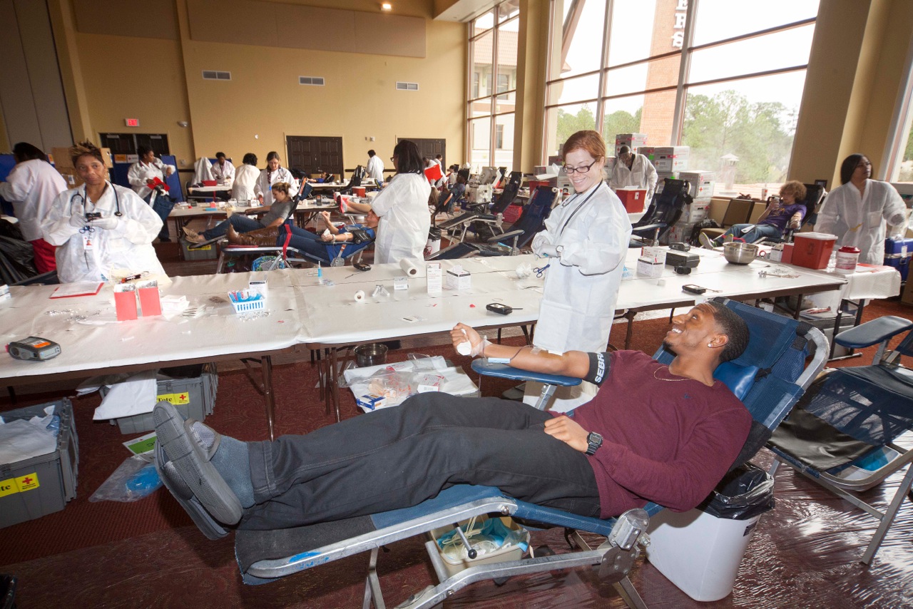 Students give blood at annual footbal team blood drive
