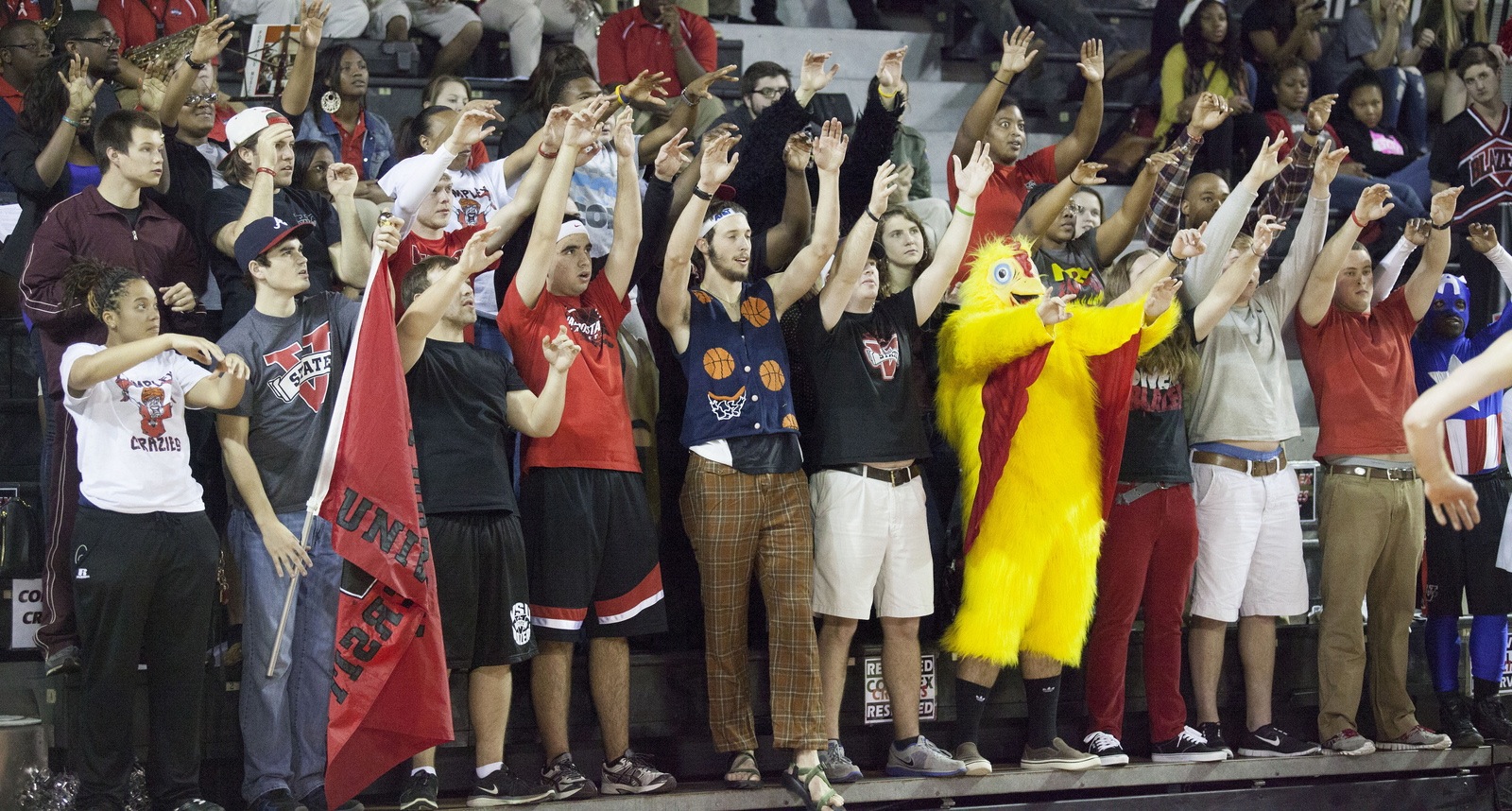 Dedicated fans, known as the Complex Crazies, cheer on the men's and women's basketball teams during home games at the P.E. Complex.