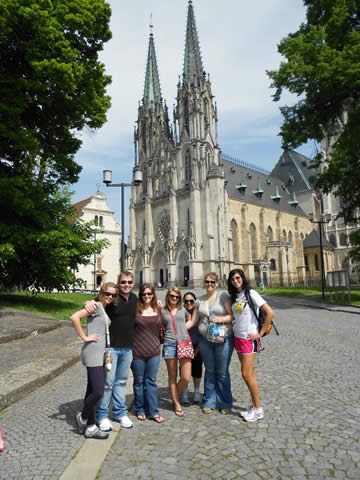 A few students from the MFT program in front of a cathedral in Olomouc, Czech Republic.