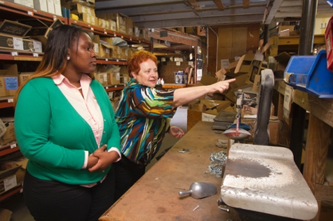 A student shadowing someone at Miller Hardware