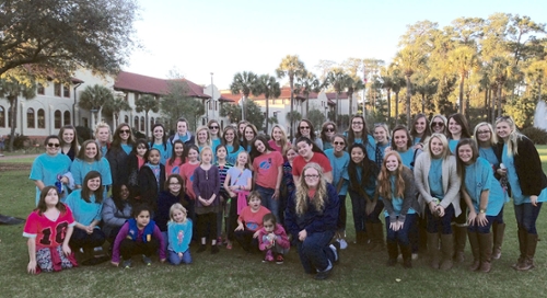 Kappa Deltas with Girl Scouts on front lawn of VSU