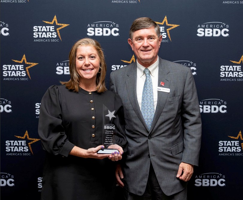 UGA SBDC at VSU Director Alyssa Foskey is presented her State Star Award by America's SBDC President and CEO Tee Rowe.