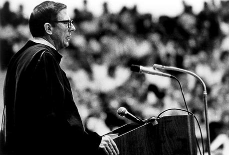 President Bailey speaking from a podium outside