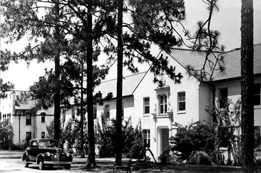 Reade Hall with an old Model T parked outside