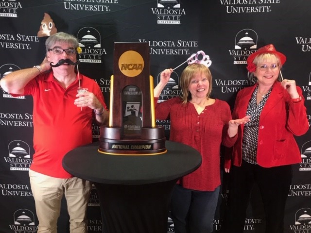 Staff with trophy at luncheon