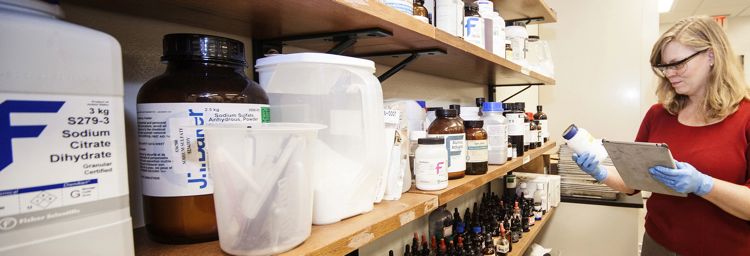 EOS Staff Member Checking Chemical Storage