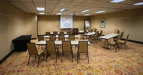 Rose Room with 6 tables and 24 chairs in classroom style