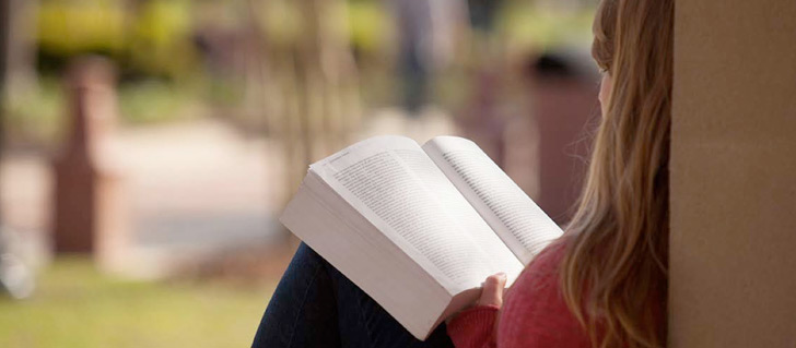 Student studying a book