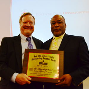 Dr. Roy Copeland receiving his award.