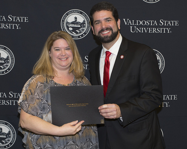 Wendy and President Carvajal receiving an award