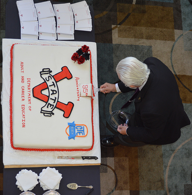 Dr. Martinez cuts the anniversary cake 