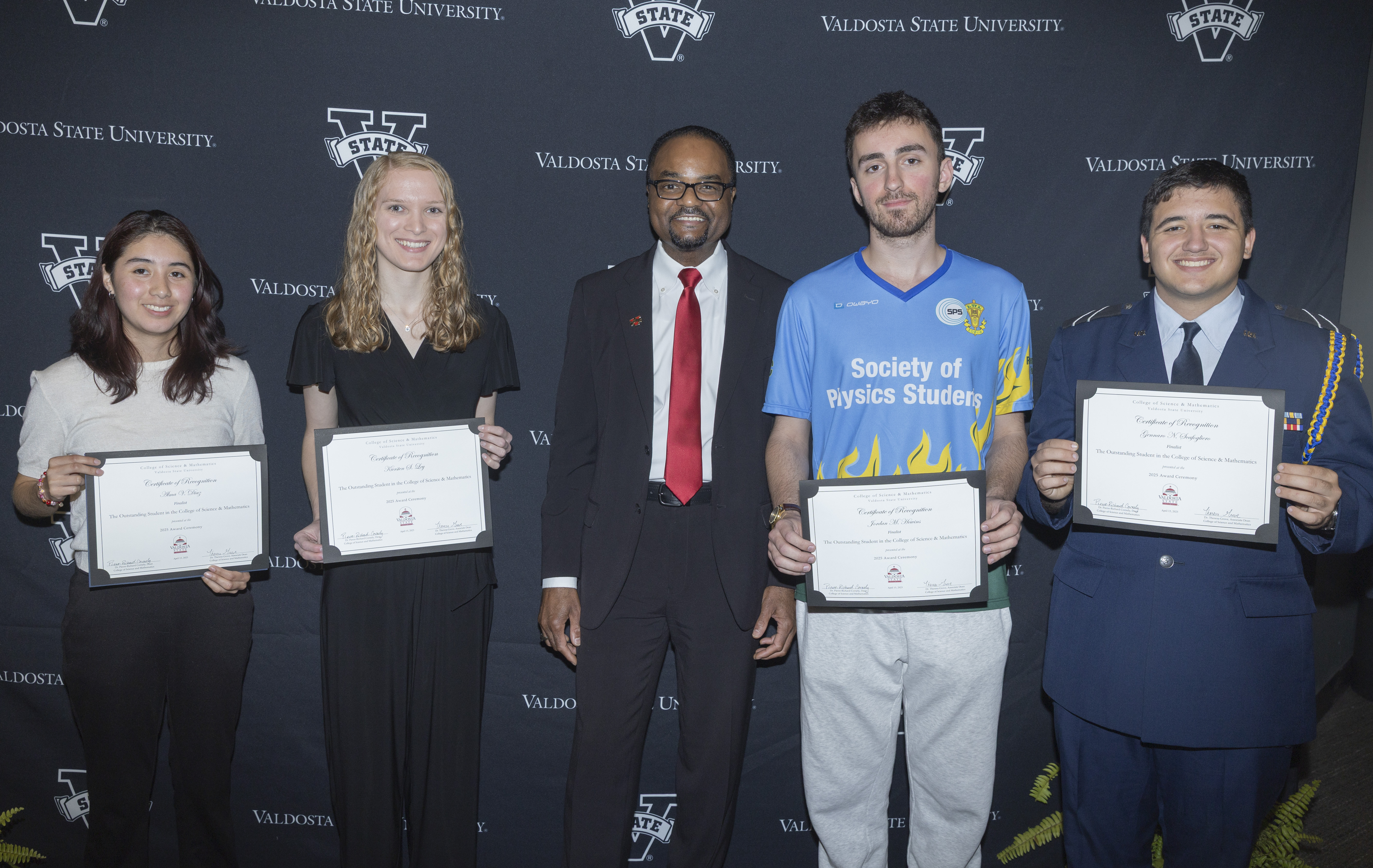 Dean Pierre-Richard Cornely with the CoSM Outstanding Student Finalists