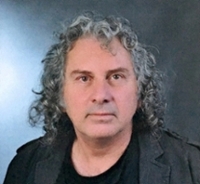 Dr. Can Denizman, PhD Portrait